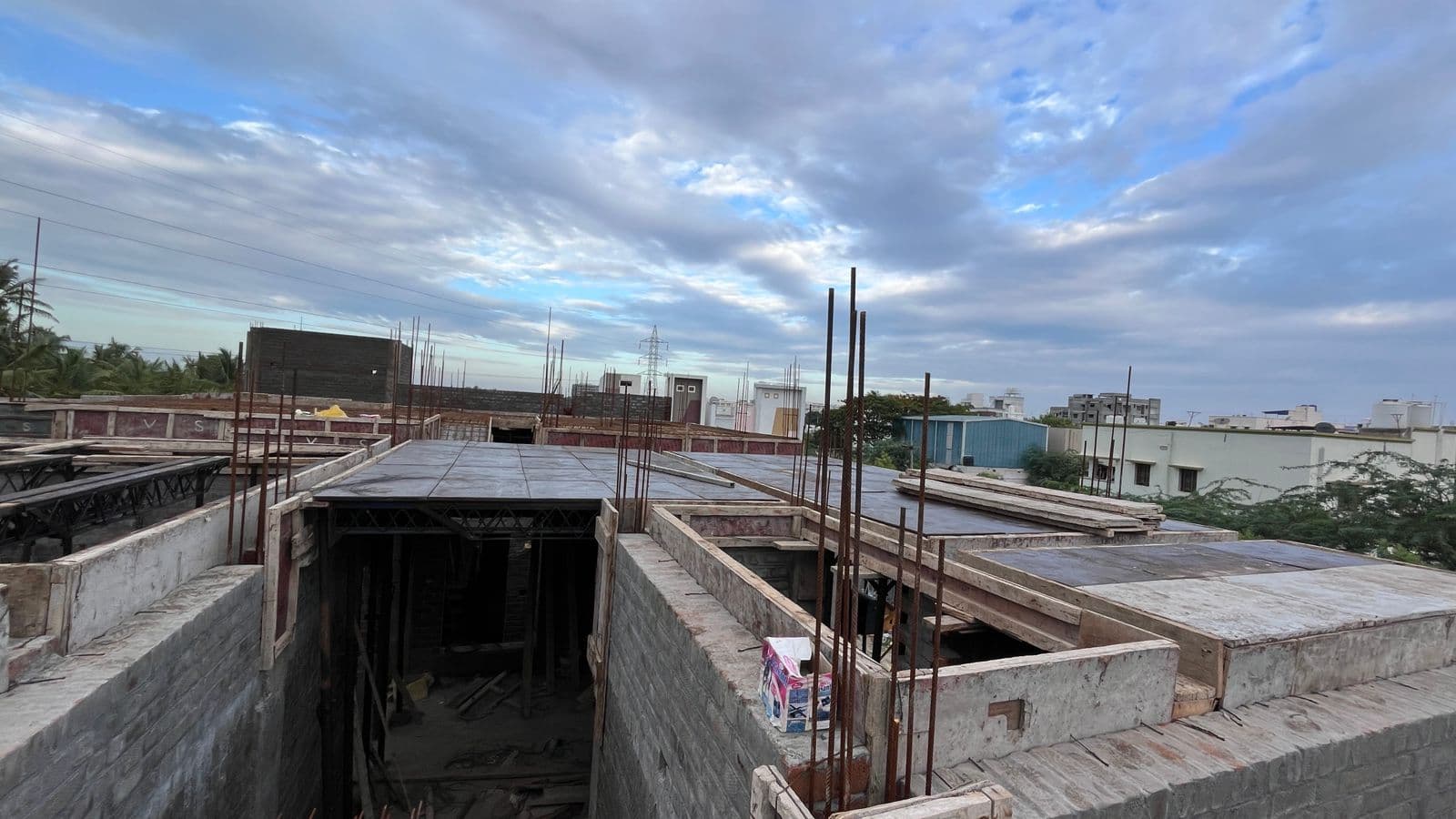 Shuttering over an opening between brick walls, seen from roof level