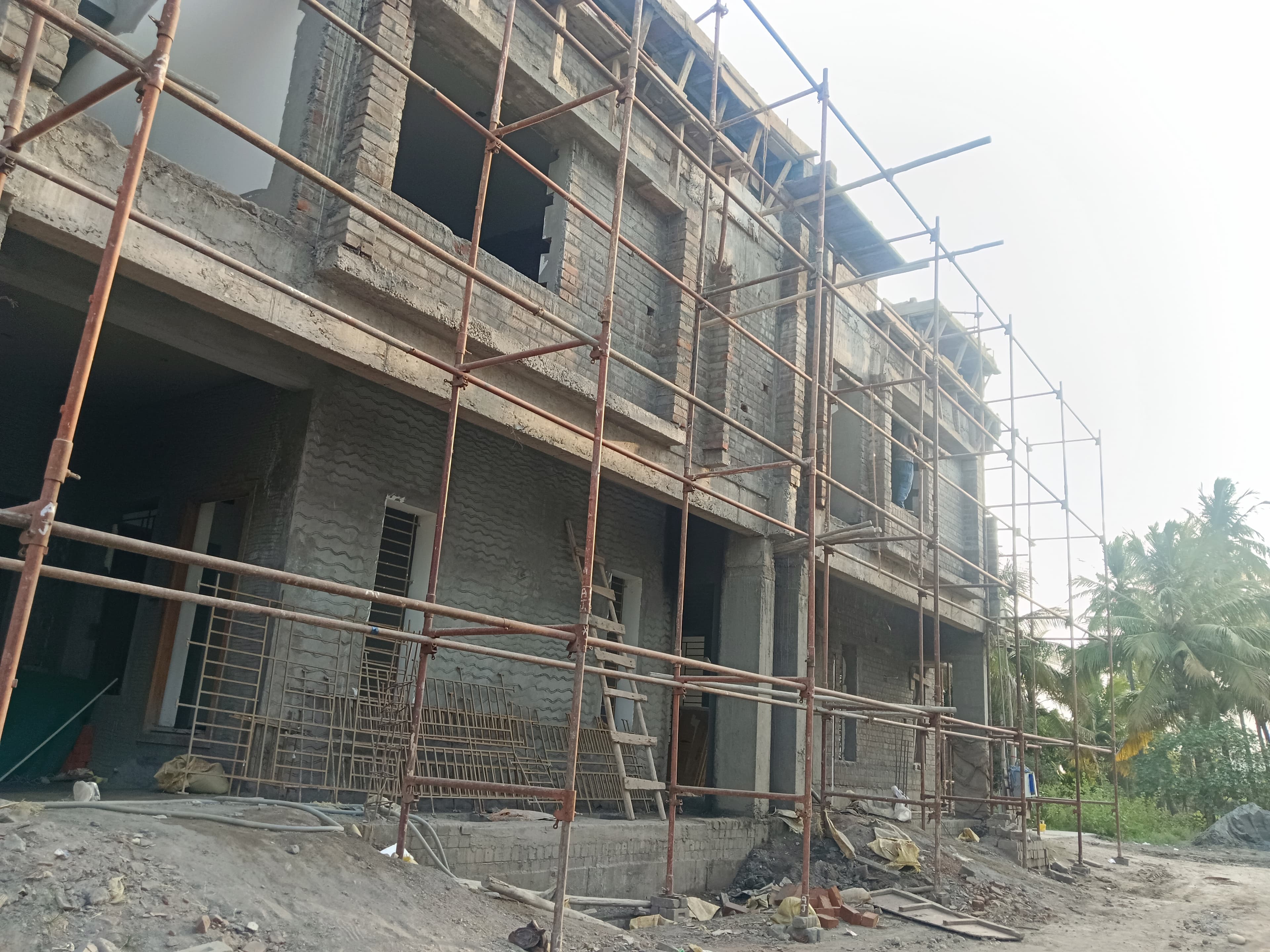 The scaffolded masonry frame from the same viewpoint in a lighter exposure