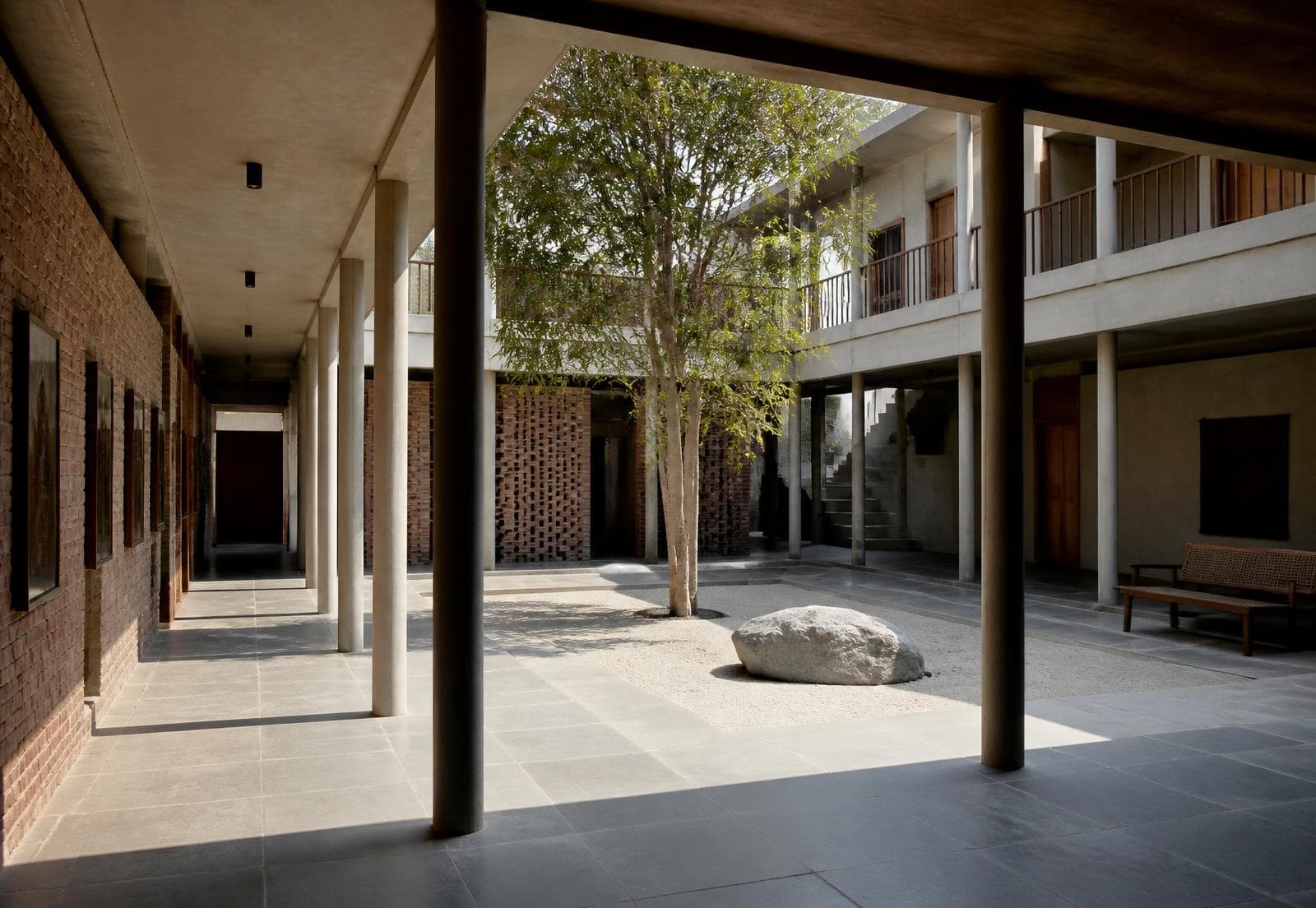 Sunken stone water basin and open sky lightwell in an ASTHIWAR courtyard residence